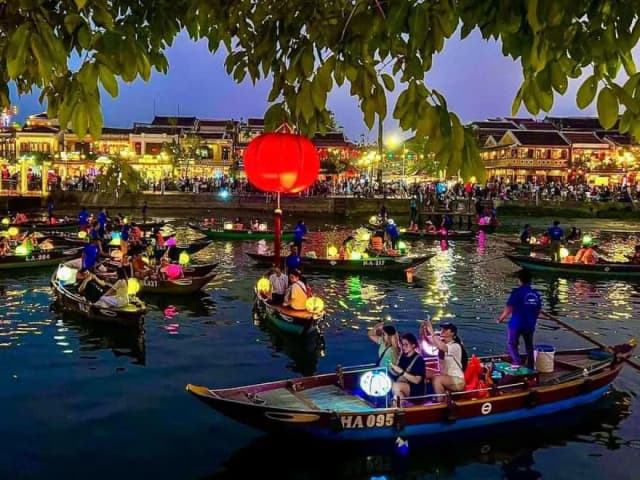 Boats floating on the Hoai River in Hoi An at night