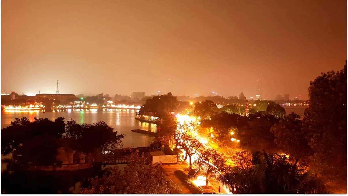 Vibrant nightlife on Hanoi Youth Street with neon lights