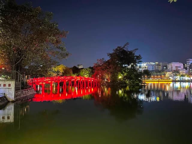 The Huc Bridge at night – a glowing red symbol of Hoan Kiem Lake, Hanoi