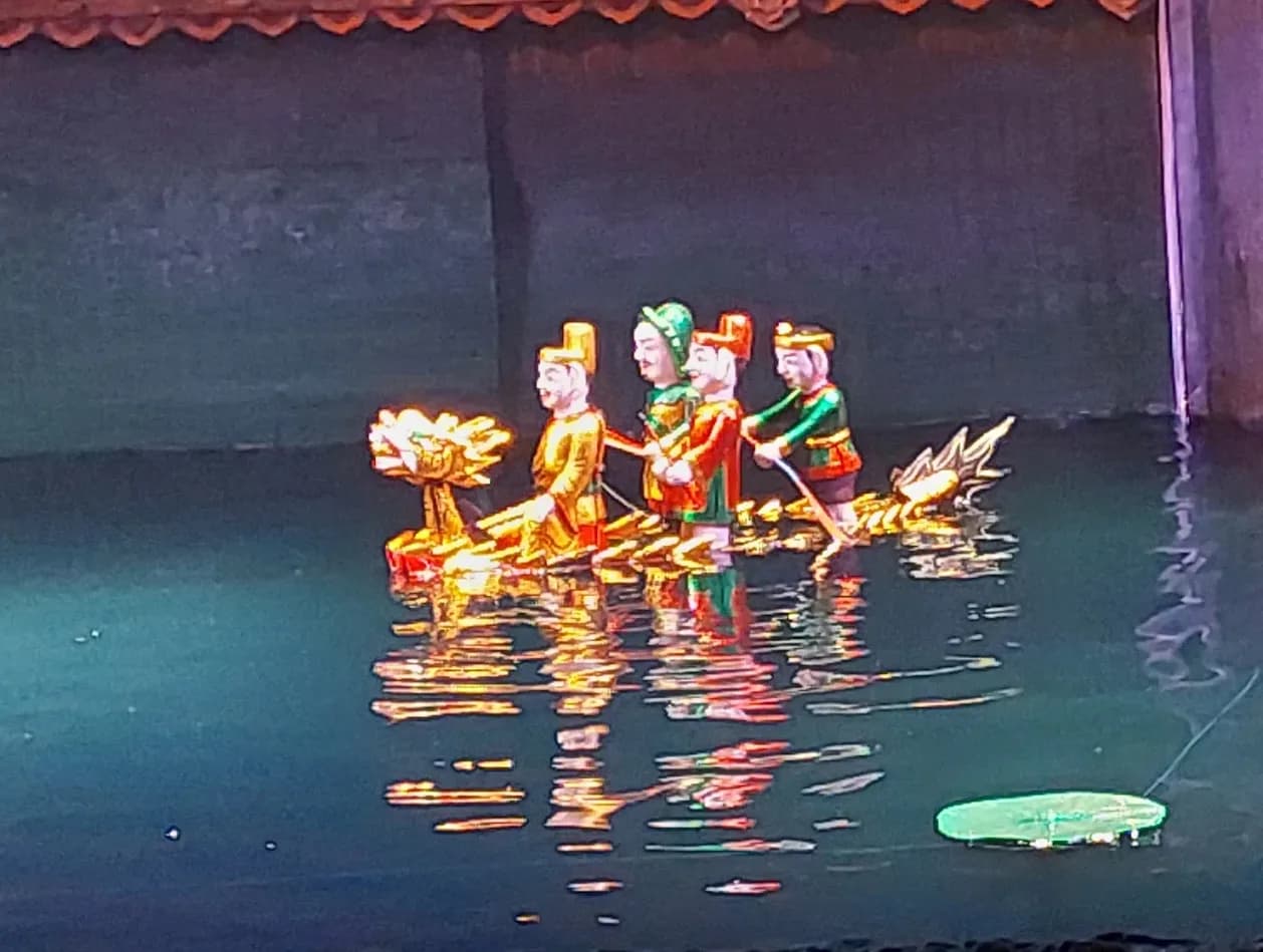 Colorful puppets performing on the water stage