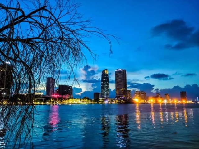 Night view of Ho Chi Minh City streets and skyscrapers