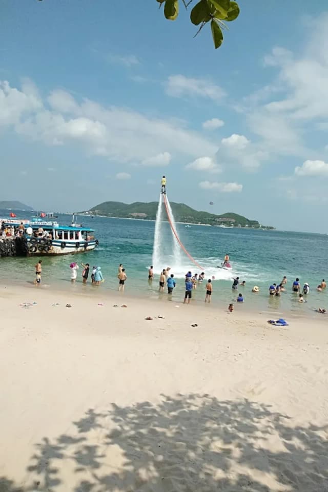 Tourists enjoying water activities at Nha Trang Beach