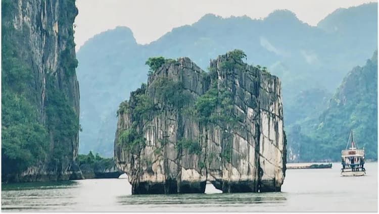 Limestone mountains rising from the emerald waters of Ha Long Bay