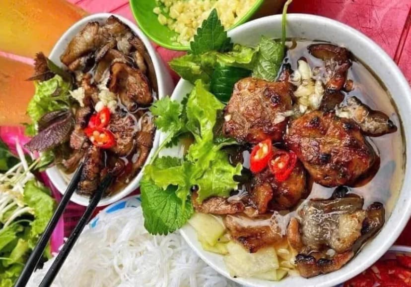 Traditional Hanoi Bun Cha served with grilled pork and fresh herbs