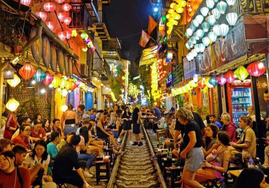 Night view of Hanoi Train Street illuminated by colorful lanterns
