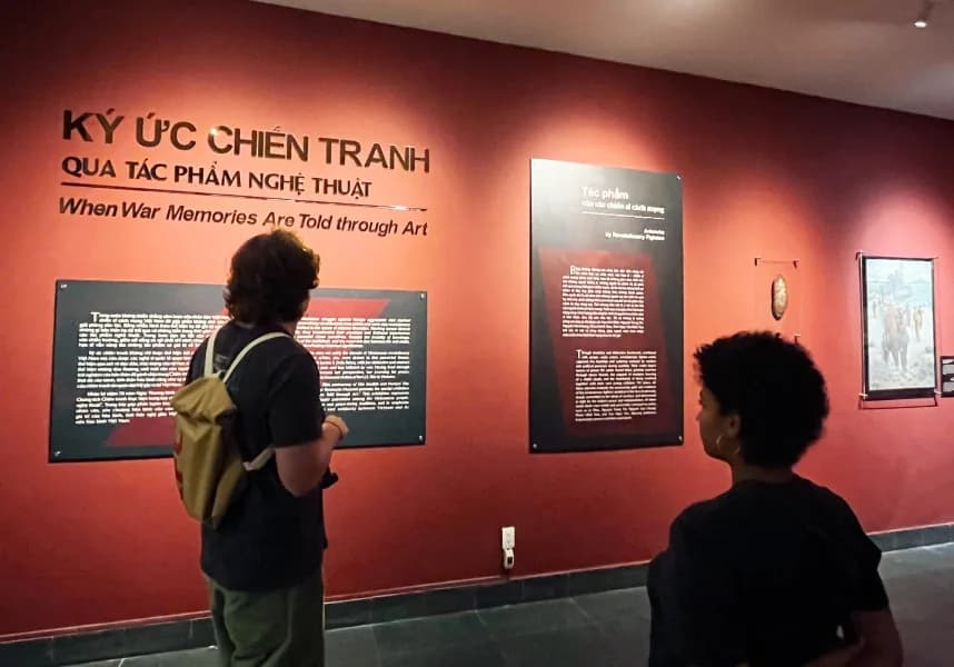 Tourists exploring exhibitions at War Remnants Museum