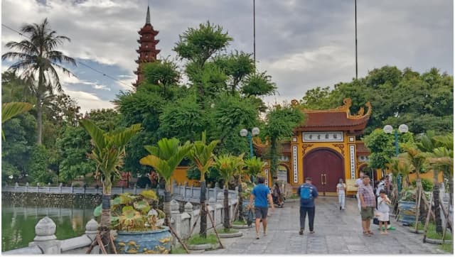 Tourists visiting Tran Quoc Pagoda, one of Hanoi’s historic sites