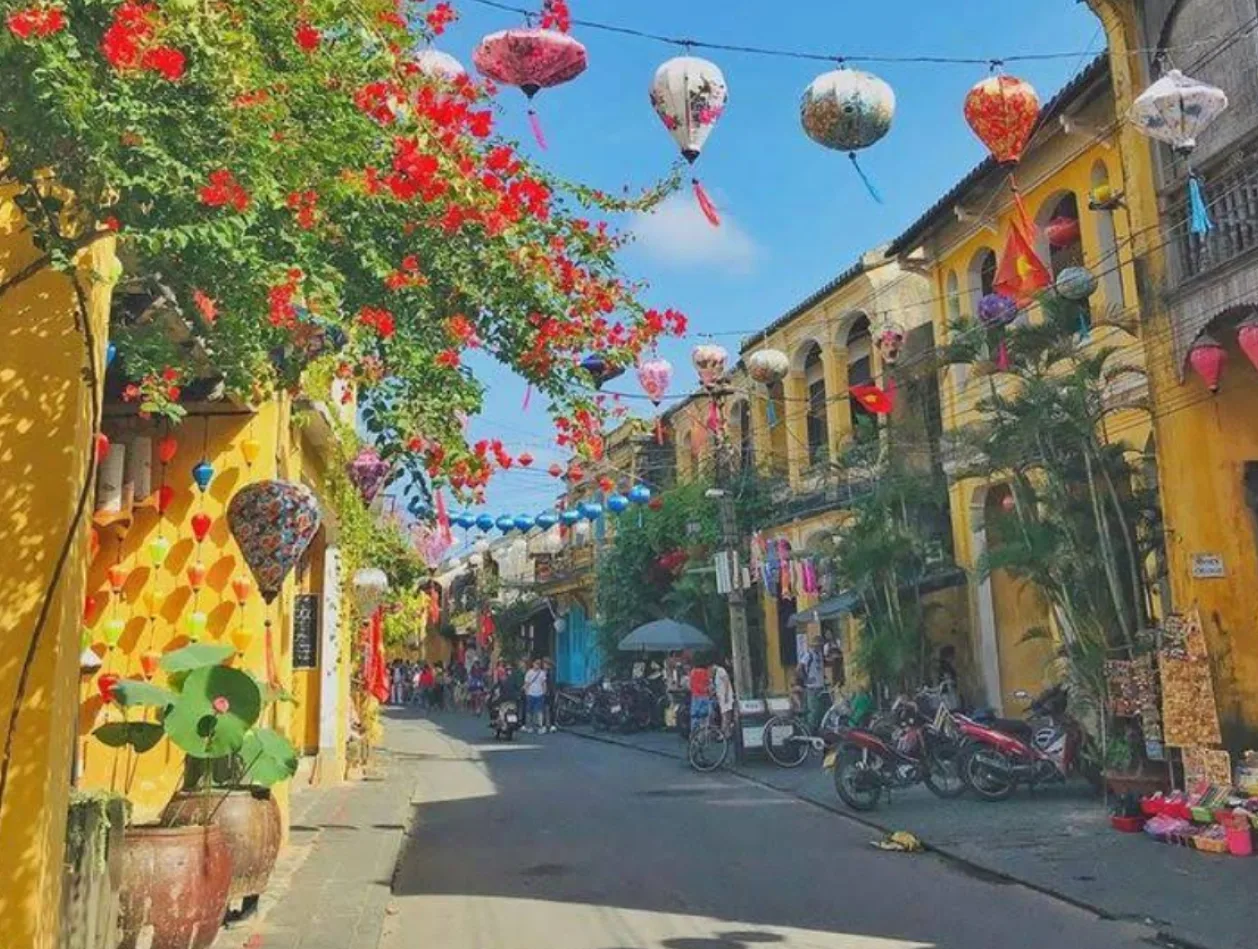 Tourists walking through lantern-lit streets in Hoi An