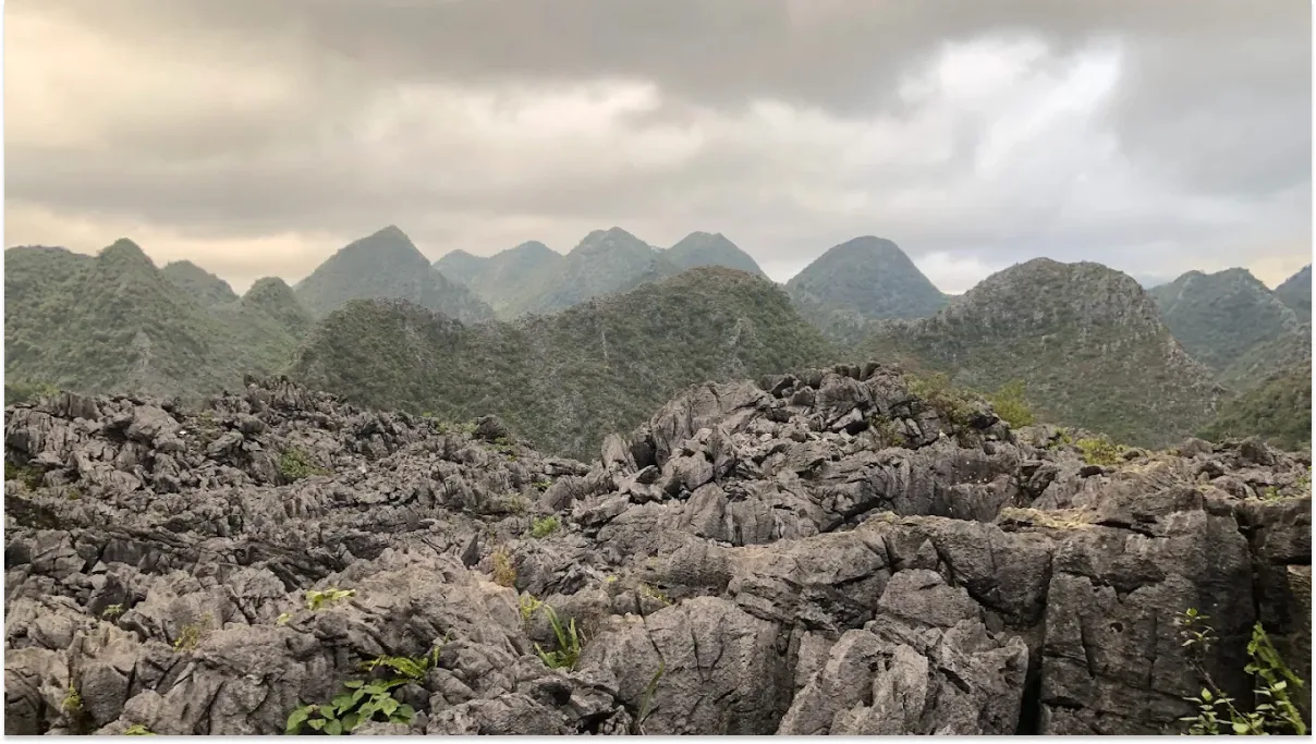 Rolling hills and karst formations in Dong Van Plateau, Ha Giang