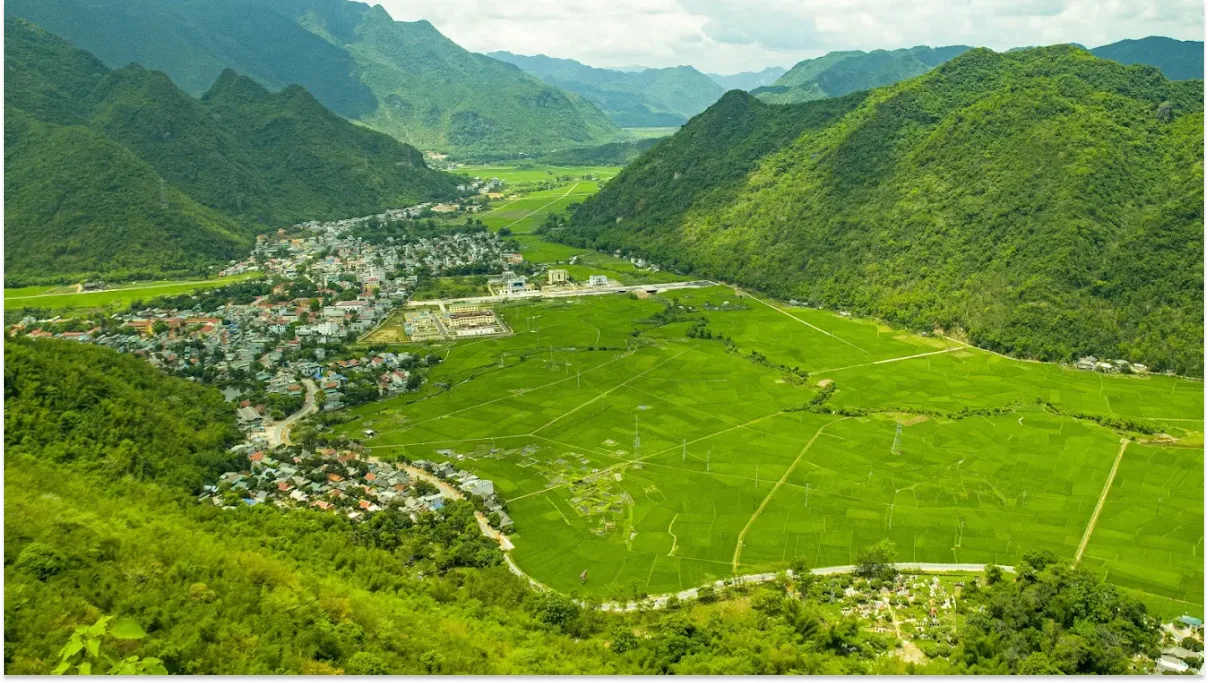Aerial view of Mai Chau rice fields surrounded by mountains and small villages