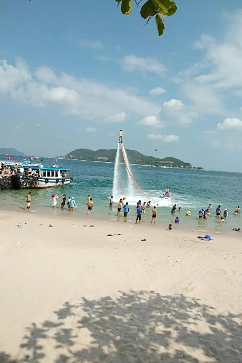 Tourists enjoying water activities at Nha Trang Beach