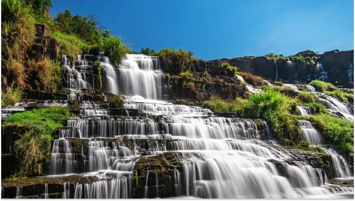 Majestic Pongour Waterfall cascading over rocky terraces