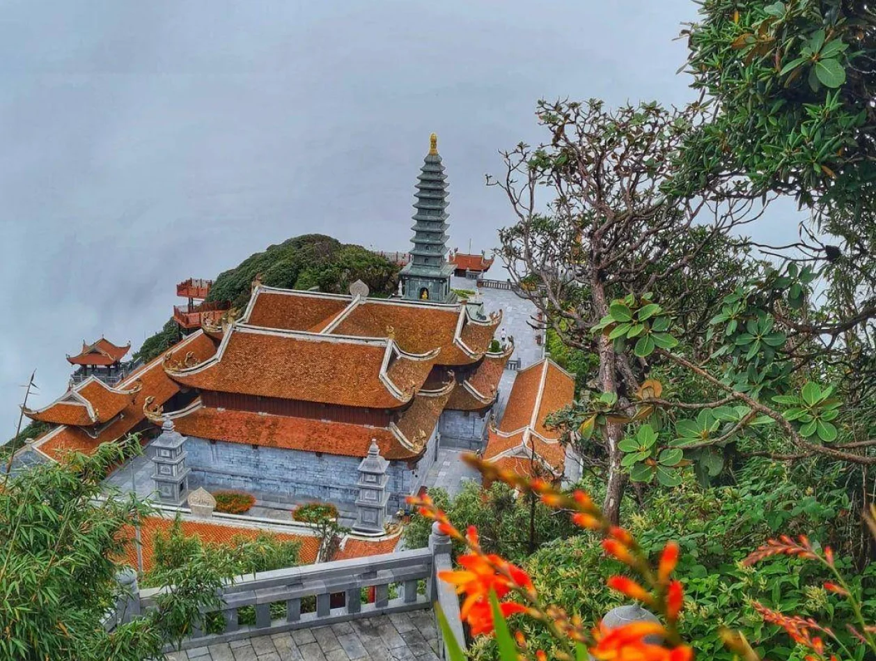Panoramic view from Fansipan with layers of mountain ranges