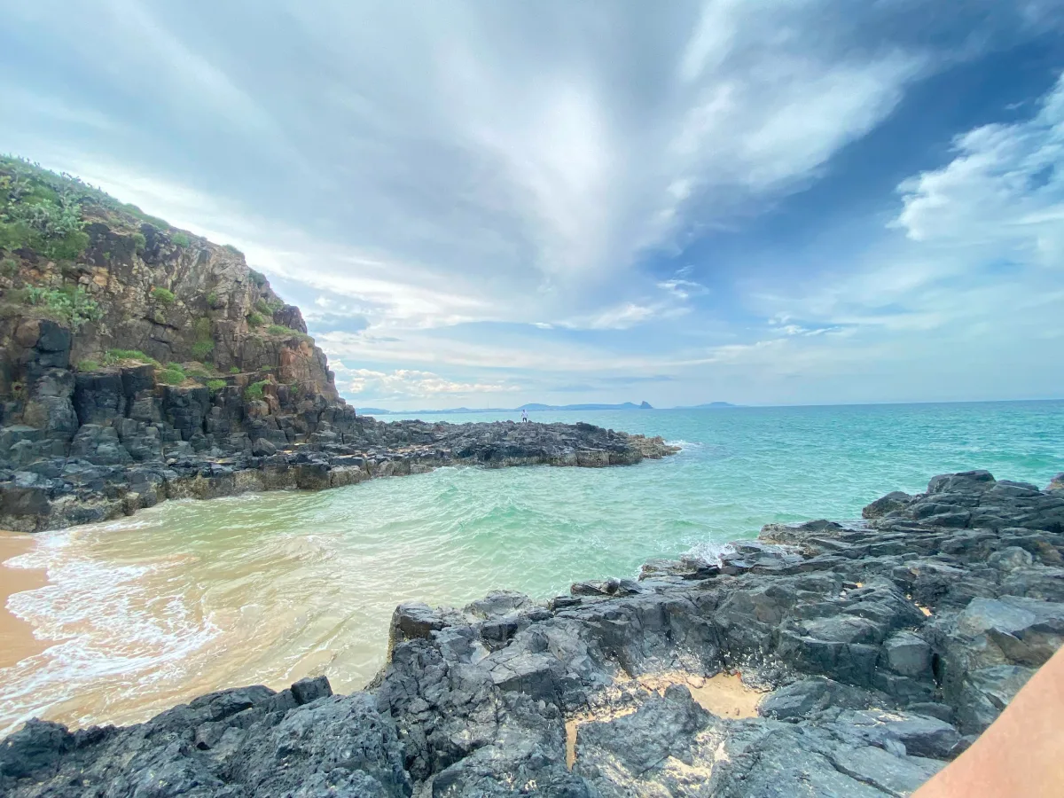 Top-down view of waves touching golden sand at Bai Xep Vietnam