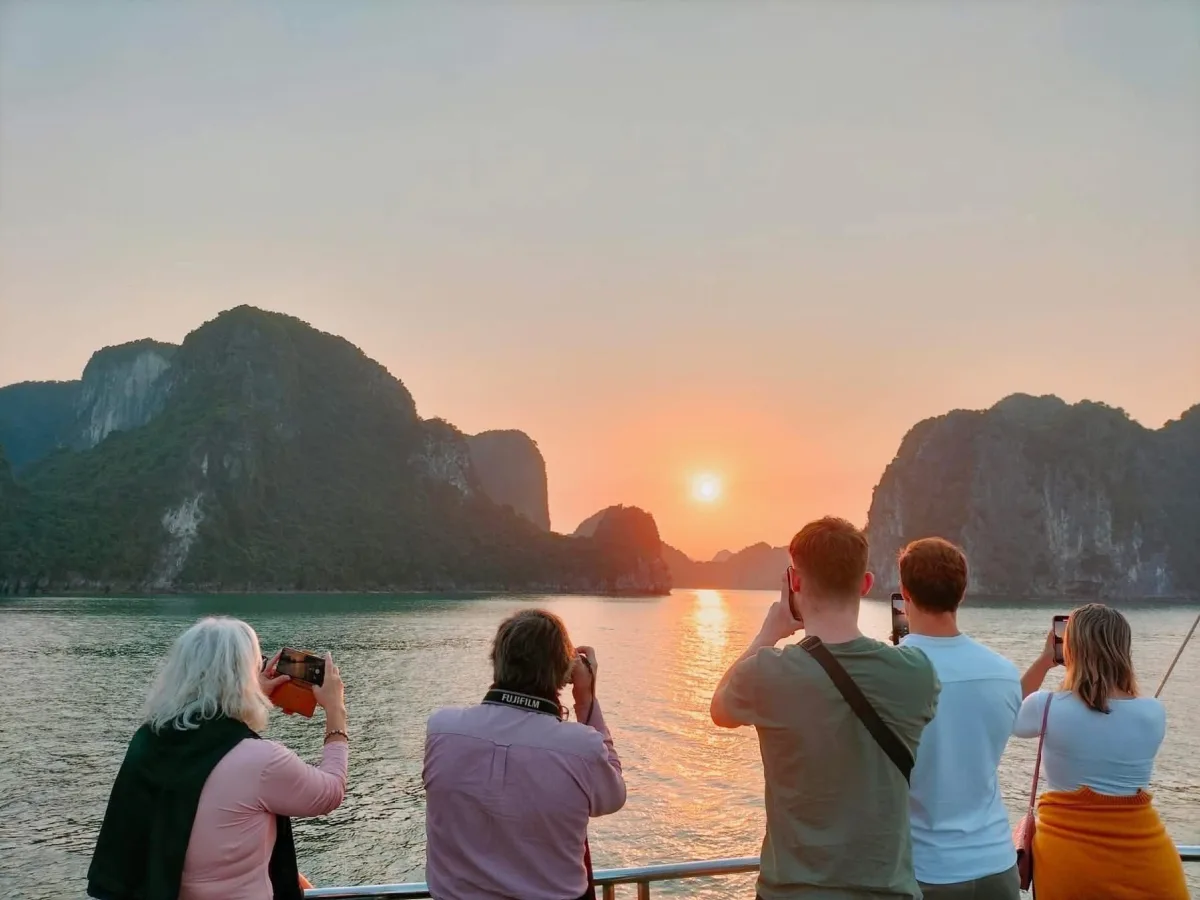Peaceful sunset scene over the emerald waters of Ha Long Bay