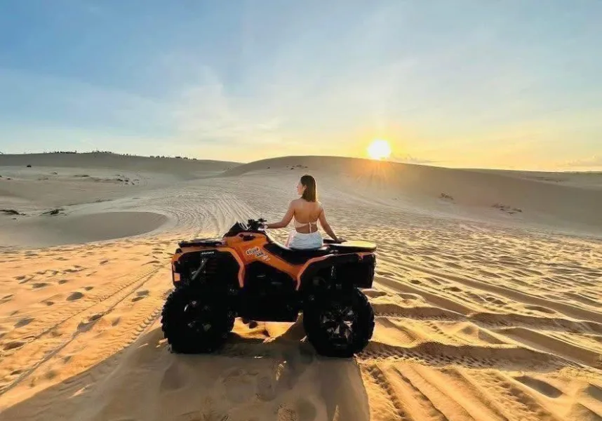 Off-road vehicles moving across Bau Trang Sand Dune