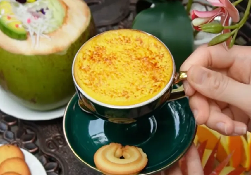 Traditional Vietnamese egg coffee served in a cup with frothy cream