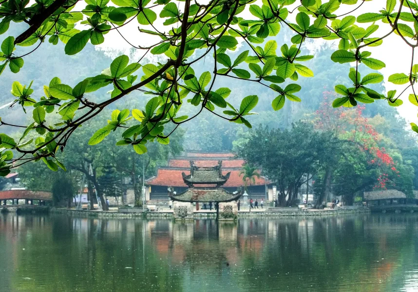 Thay Pagoda surrounded by mountains and a peaceful lake