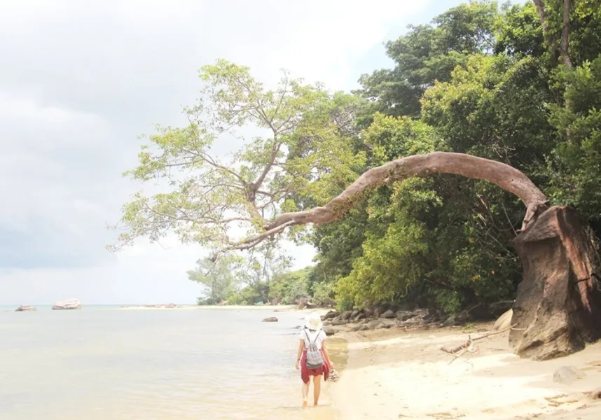 Peaceful walk along Phu Quoc Beach with gentle waves